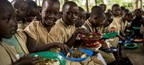 Children eating lunch at a primary school in Burundi