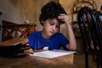 A child in Argentina, doing his homework