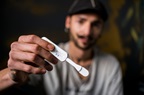 A man in Bulgaria shows a HIV self-test stick