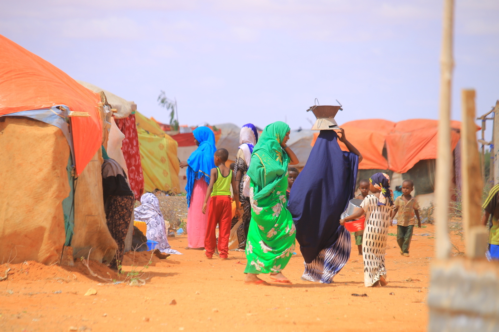 Women and children walk in the streets of drought-affected Garowe, Somalia