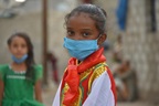 A young girl child in Yemen with face mask
